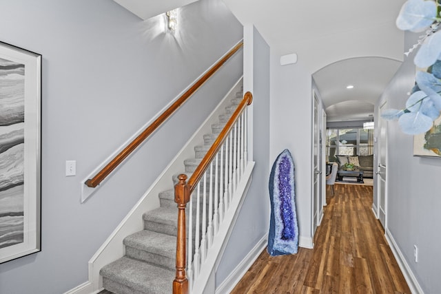 stairs with hardwood / wood-style floors