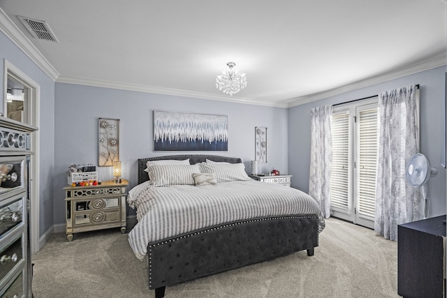 carpeted bedroom featuring a chandelier and ornamental molding