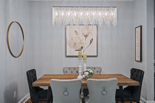 dining space with an inviting chandelier