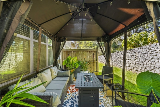 unfurnished sunroom with lofted ceiling and track lighting