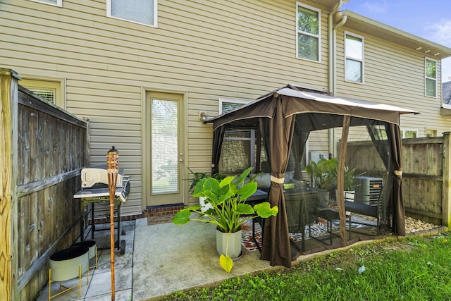 view of patio / terrace featuring a gazebo and central air condition unit