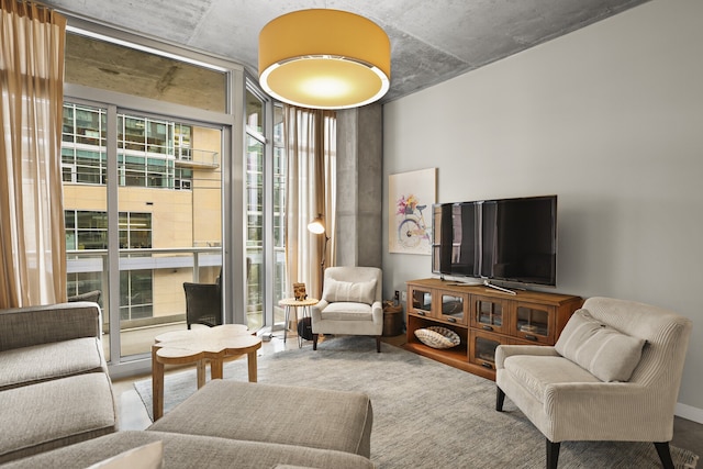 living room with a healthy amount of sunlight and hardwood / wood-style flooring