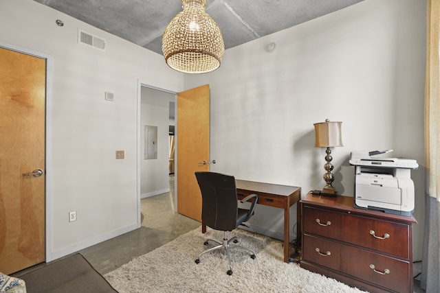 office area with concrete floors