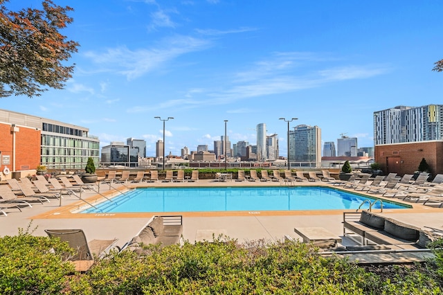 view of swimming pool featuring a patio area