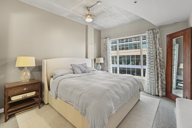 bedroom with ceiling fan, light colored carpet, and access to outside