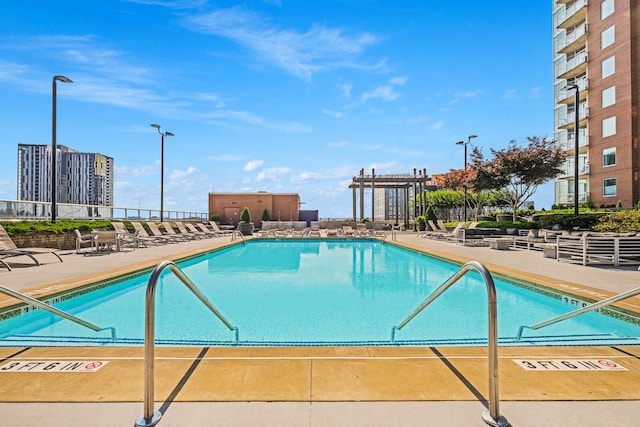 view of swimming pool featuring a patio area