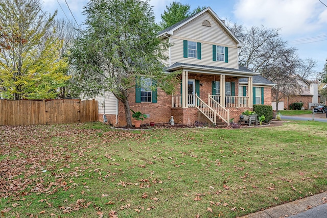 front facade featuring a front lawn and a porch