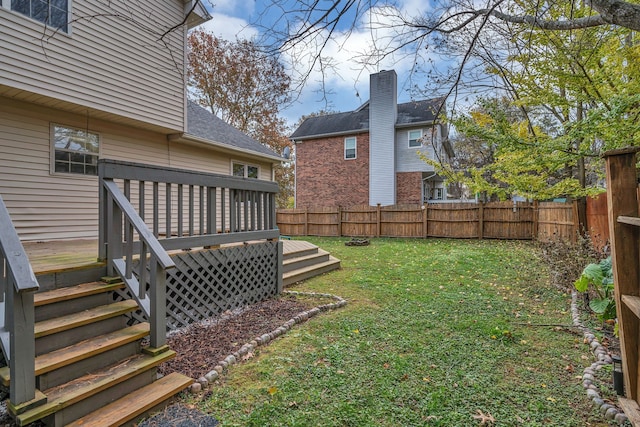 view of yard with a wooden deck