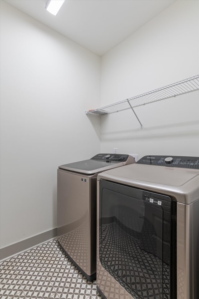 clothes washing area featuring washer and dryer