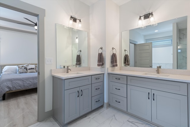 bathroom featuring ceiling fan, vanity, and wood-type flooring