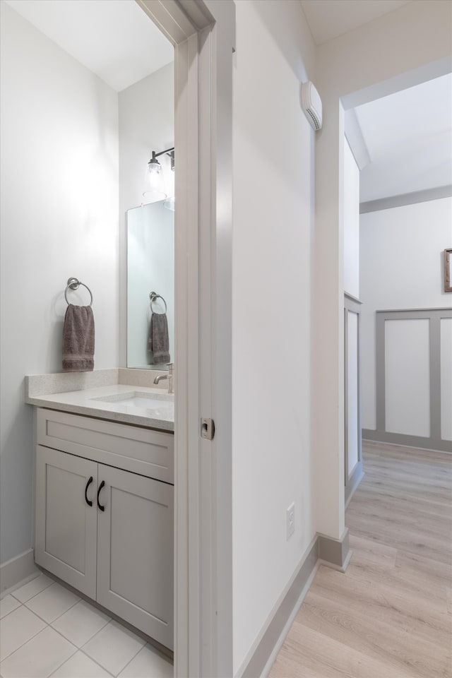 bathroom with vanity and wood-type flooring