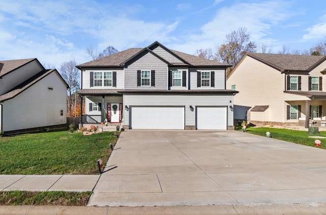 view of front property featuring a porch, a garage, and a front lawn