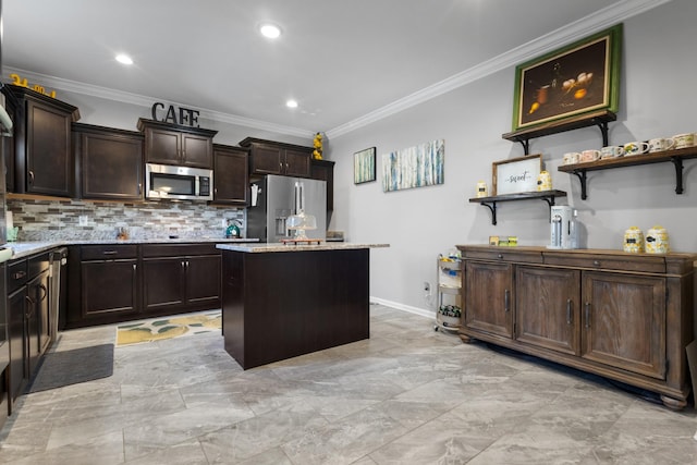 kitchen featuring dark brown cabinets, stainless steel appliances, a kitchen island, and ornamental molding