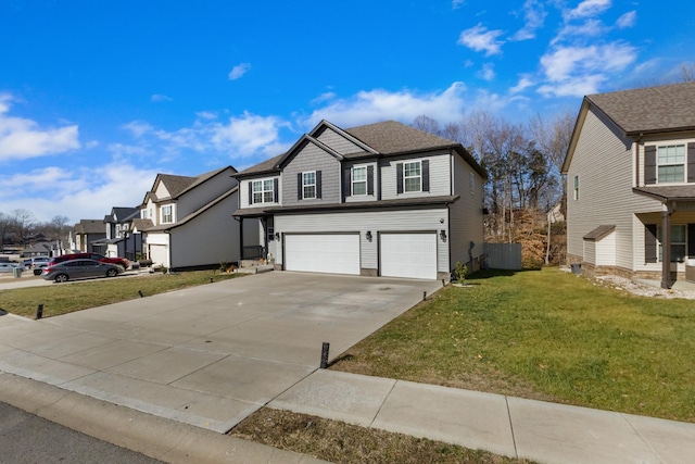 view of front of home featuring a garage and a front lawn