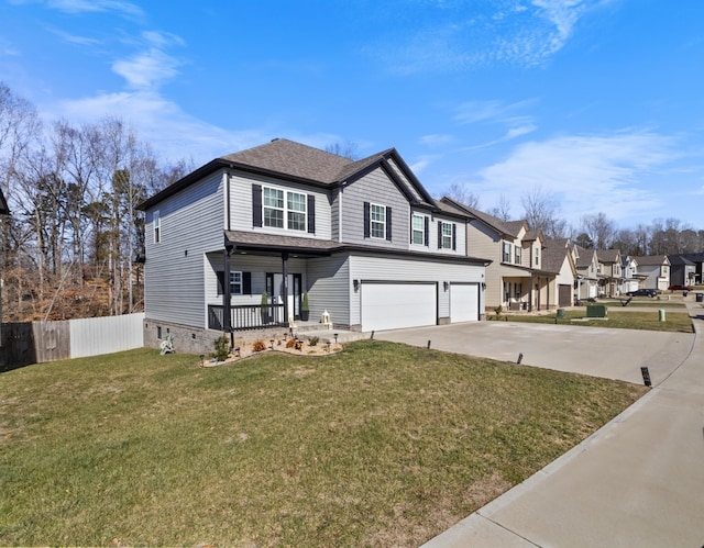 view of front property with a garage, covered porch, and a front lawn