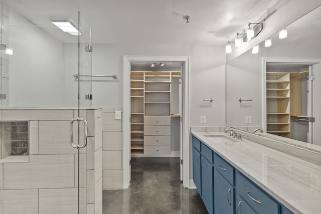 bathroom featuring vanity, concrete floors, and an enclosed shower