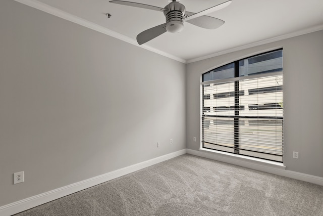 unfurnished room with light colored carpet, plenty of natural light, and crown molding