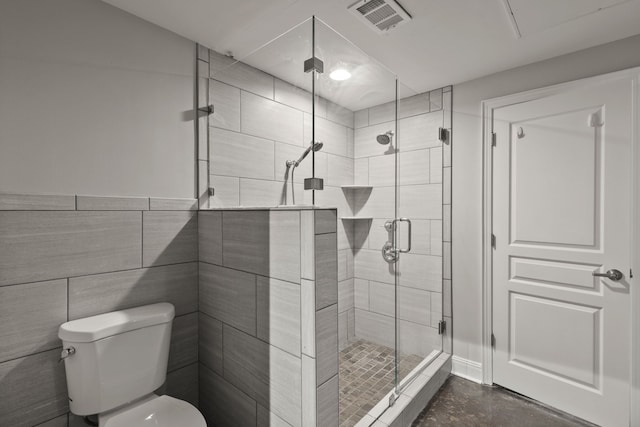 bathroom with toilet, walk in shower, and tile walls