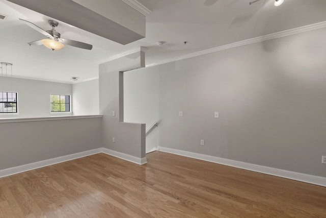 unfurnished room featuring crown molding, ceiling fan, and light hardwood / wood-style floors