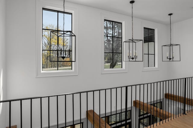 interior space featuring hardwood / wood-style flooring and a notable chandelier