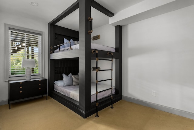 bedroom with light colored carpet