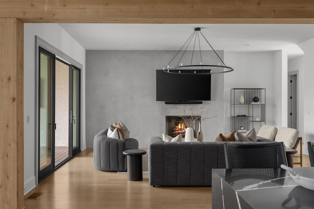 living room featuring light hardwood / wood-style floors and french doors