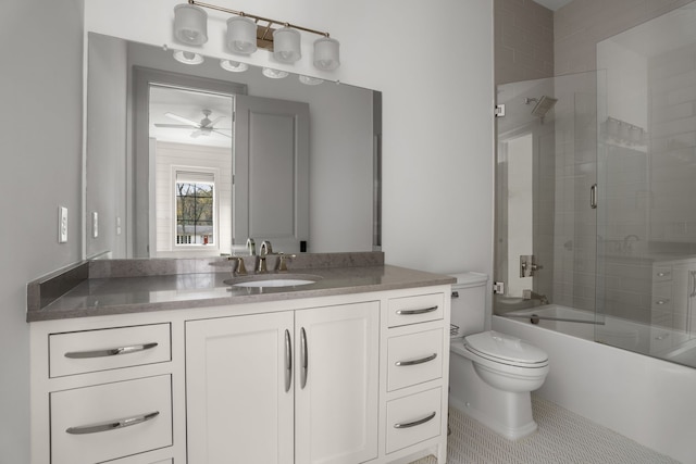 full bathroom featuring ceiling fan, tile patterned flooring, combined bath / shower with glass door, toilet, and vanity