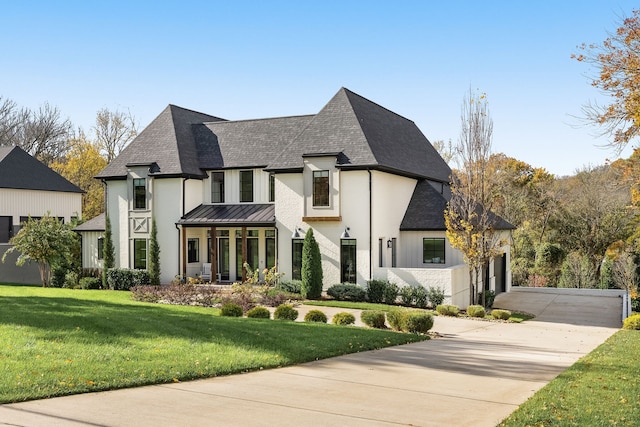 french country home featuring a front yard