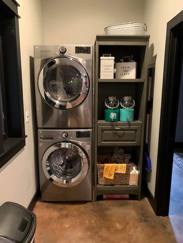 laundry room with stacked washer / dryer