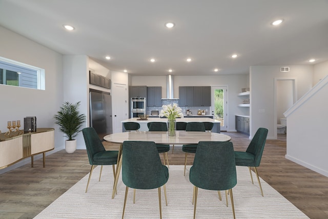 dining space featuring light hardwood / wood-style floors