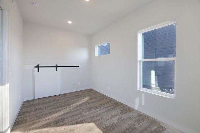 spare room featuring hardwood / wood-style flooring