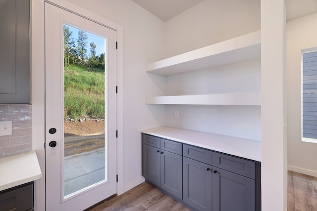 doorway to outside with light wood-type flooring