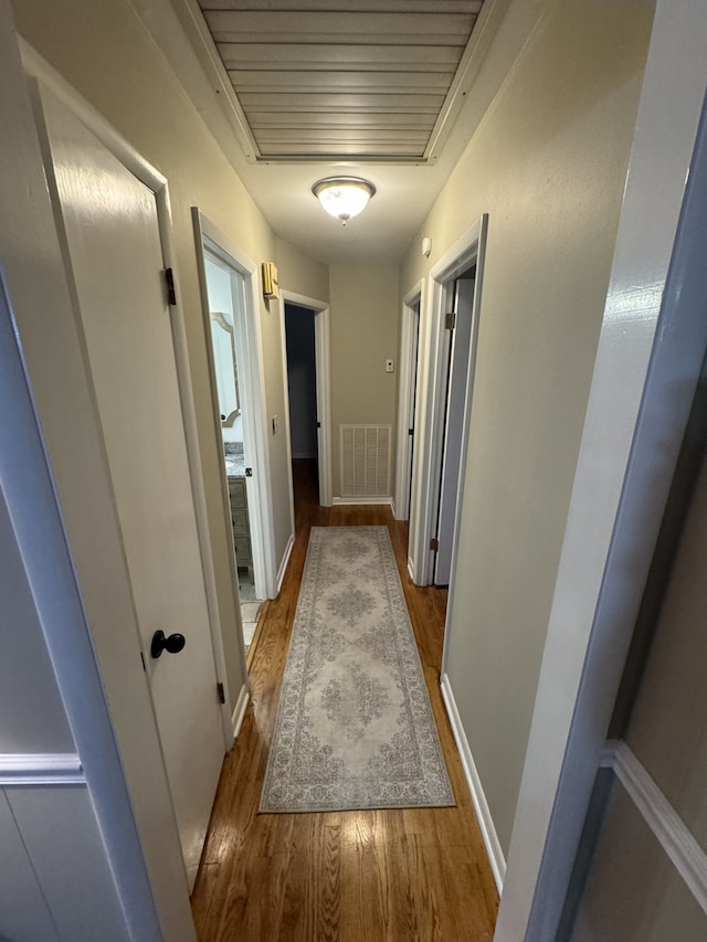 corridor featuring hardwood / wood-style flooring