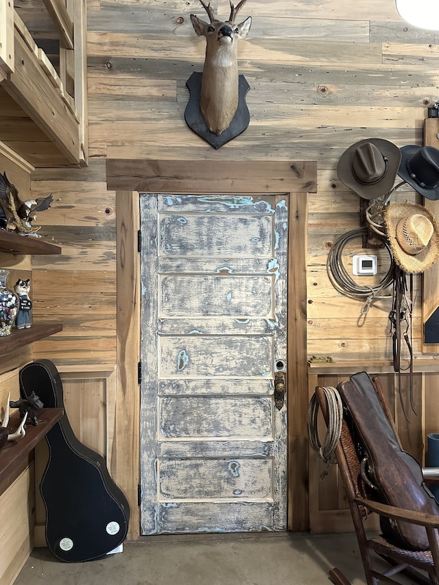 details with concrete floors and wood walls