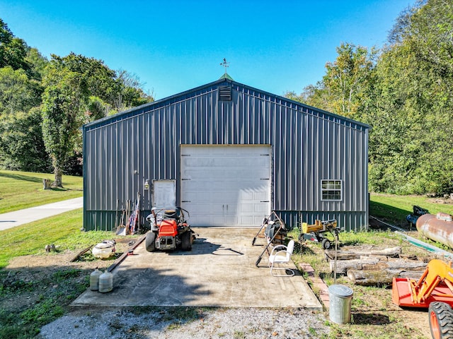 garage with a yard