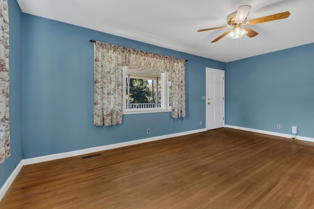 unfurnished room with hardwood / wood-style flooring and ceiling fan