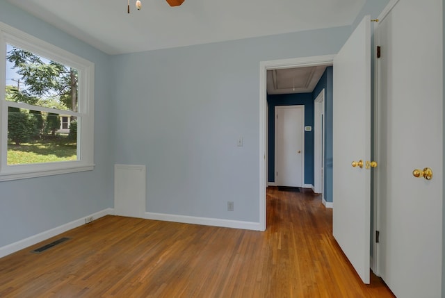 unfurnished room featuring ceiling fan and light hardwood / wood-style floors