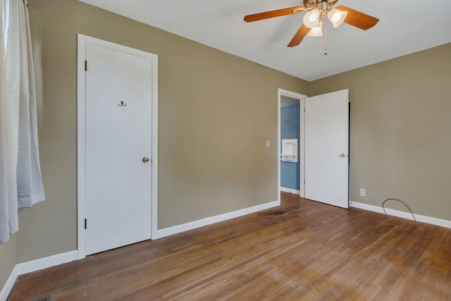 spare room featuring hardwood / wood-style floors and ceiling fan