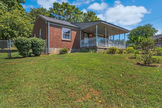 view of front facade with covered porch and a front lawn