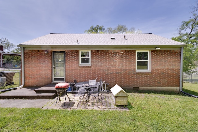 back of house featuring a yard and a patio area