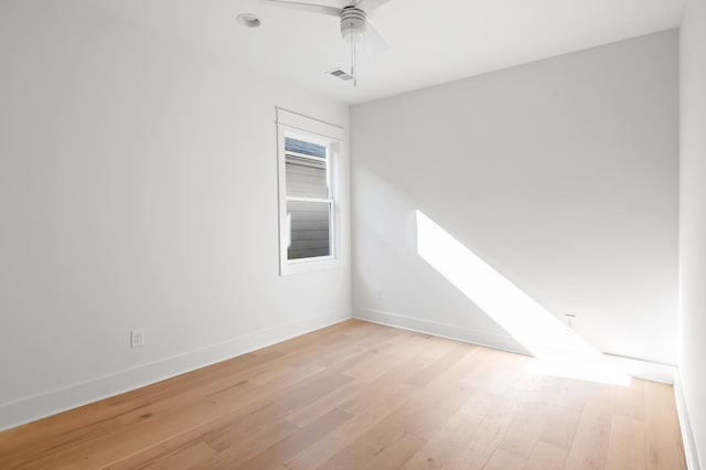 unfurnished room with ceiling fan and light hardwood / wood-style flooring