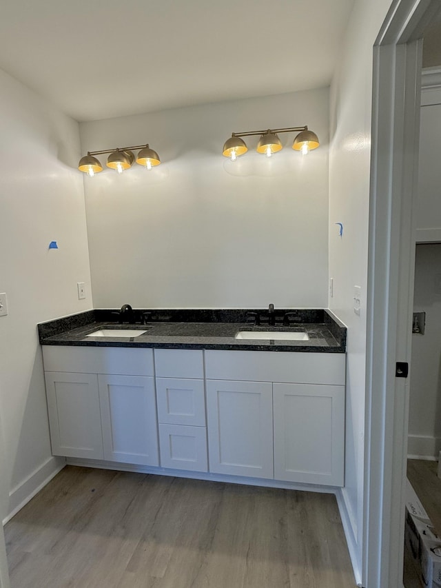 bathroom featuring hardwood / wood-style floors and vanity