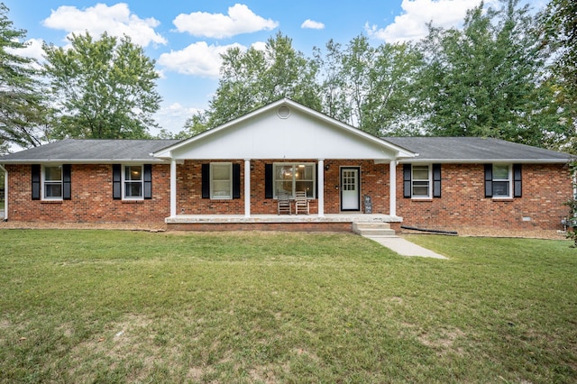 ranch-style home with covered porch and a front lawn