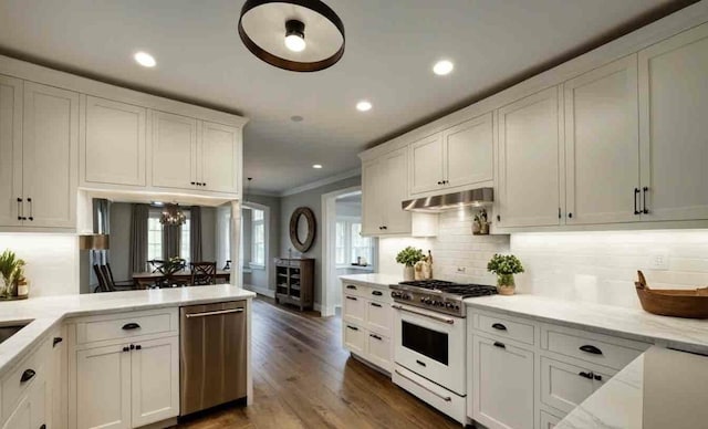 kitchen featuring white cabinetry, high end white range, dishwasher, decorative backsplash, and dark wood-type flooring