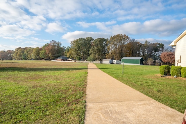 view of home's community featuring a lawn