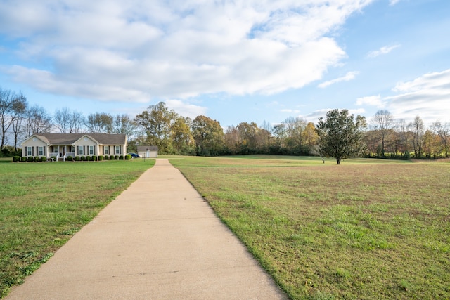 view of property's community featuring a lawn