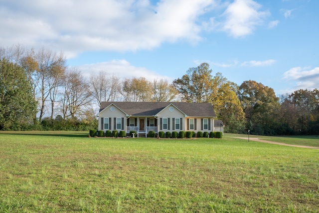 ranch-style home with a porch and a front yard