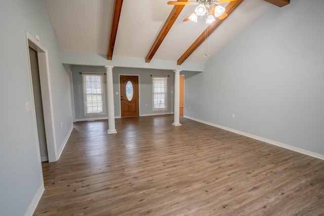 entryway with vaulted ceiling with beams, ceiling fan, wood finished floors, baseboards, and ornate columns