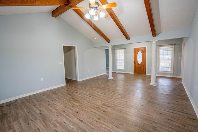 unfurnished living room with decorative columns, baseboards, a ceiling fan, wood finished floors, and beam ceiling