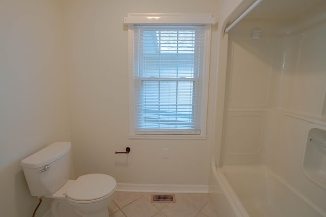 bathroom featuring tile patterned flooring, toilet, visible vents, bathing tub / shower combination, and baseboards